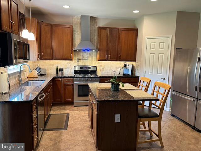 83 Zelkova Road Smyrna, DE 19977 - Photo 23 of 117 a kitchen with stainless steel appliances granite countertop a stove refrigerator sink and cabinets