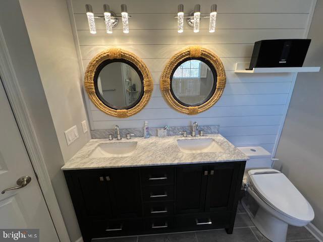 83 Zelkova Road Smyrna, DE 19977 - Photo 50 of 117 a bathroom with a toilet a sink and a mirror