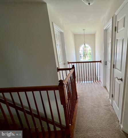 83 Zelkova Road Smyrna, DE 19977 - Photo 57 of 117 a view of a hallway with wooden floor and staircase