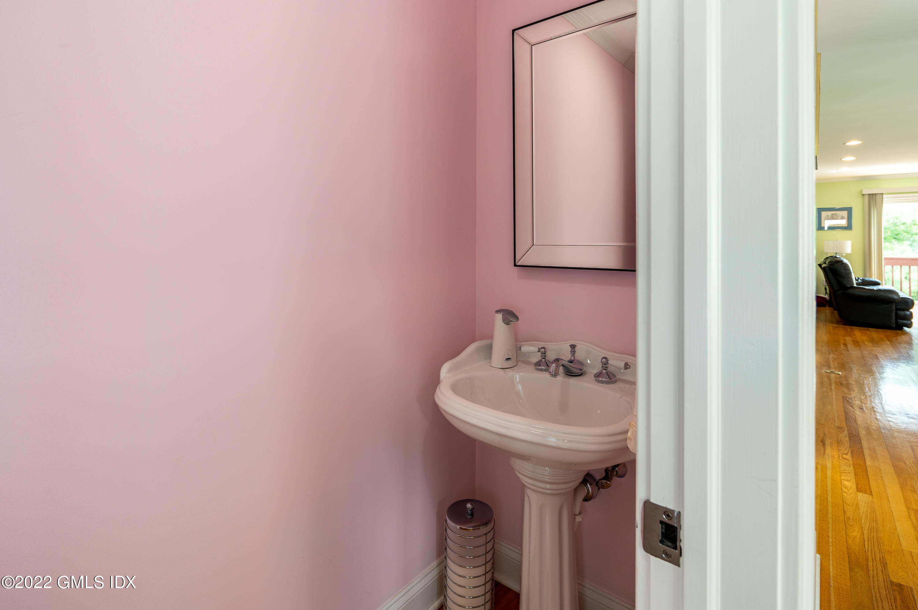 53 Rodwell Avenue, Unit B Greenwich, CT 06830 - Photo 18 of 33 a bathroom with a sink and a mirror
