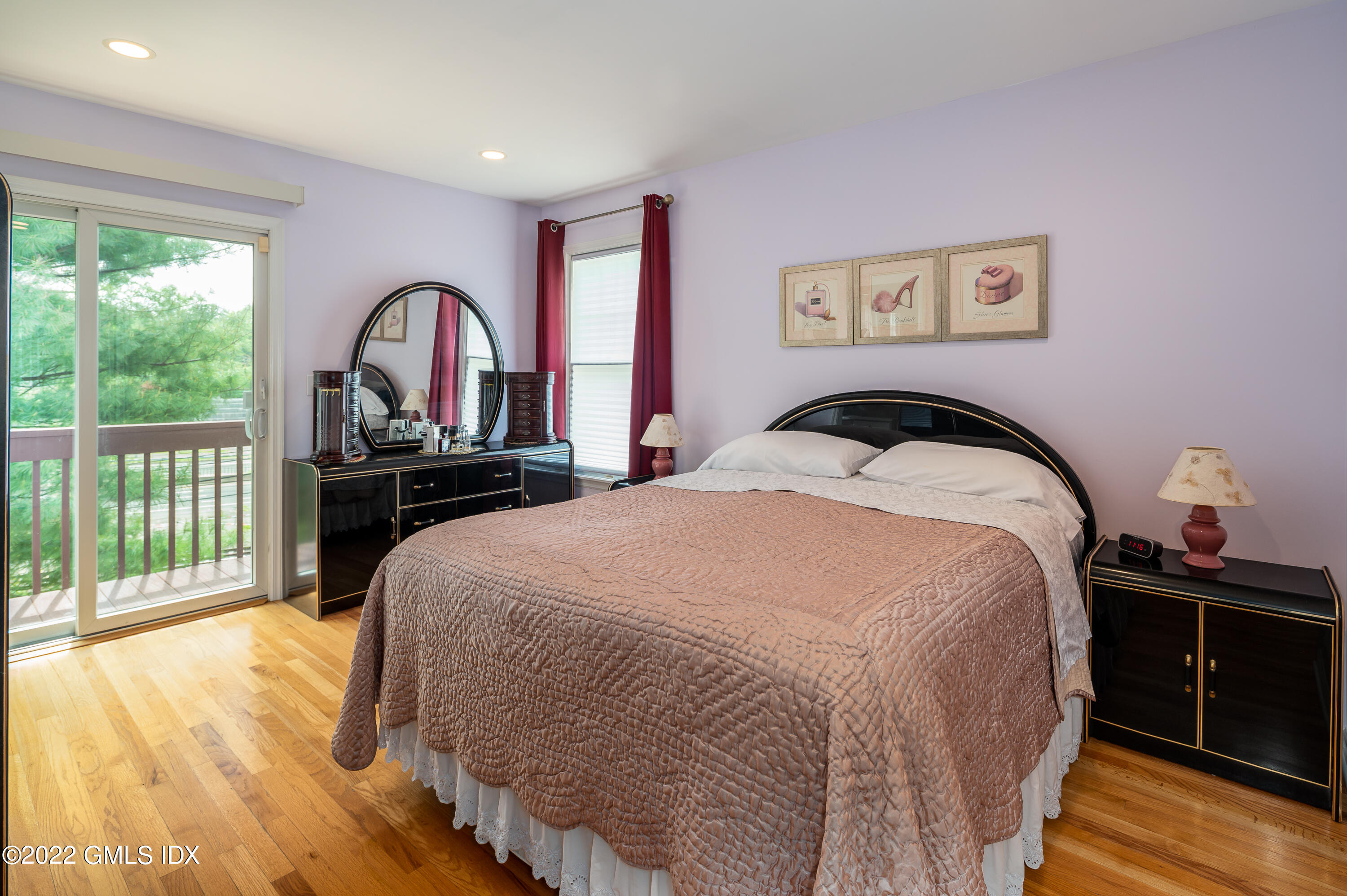 53 Rodwell Avenue, Unit B Greenwich, CT 06830 - Photo 19 of 33 a bedroom with a bed and a large window