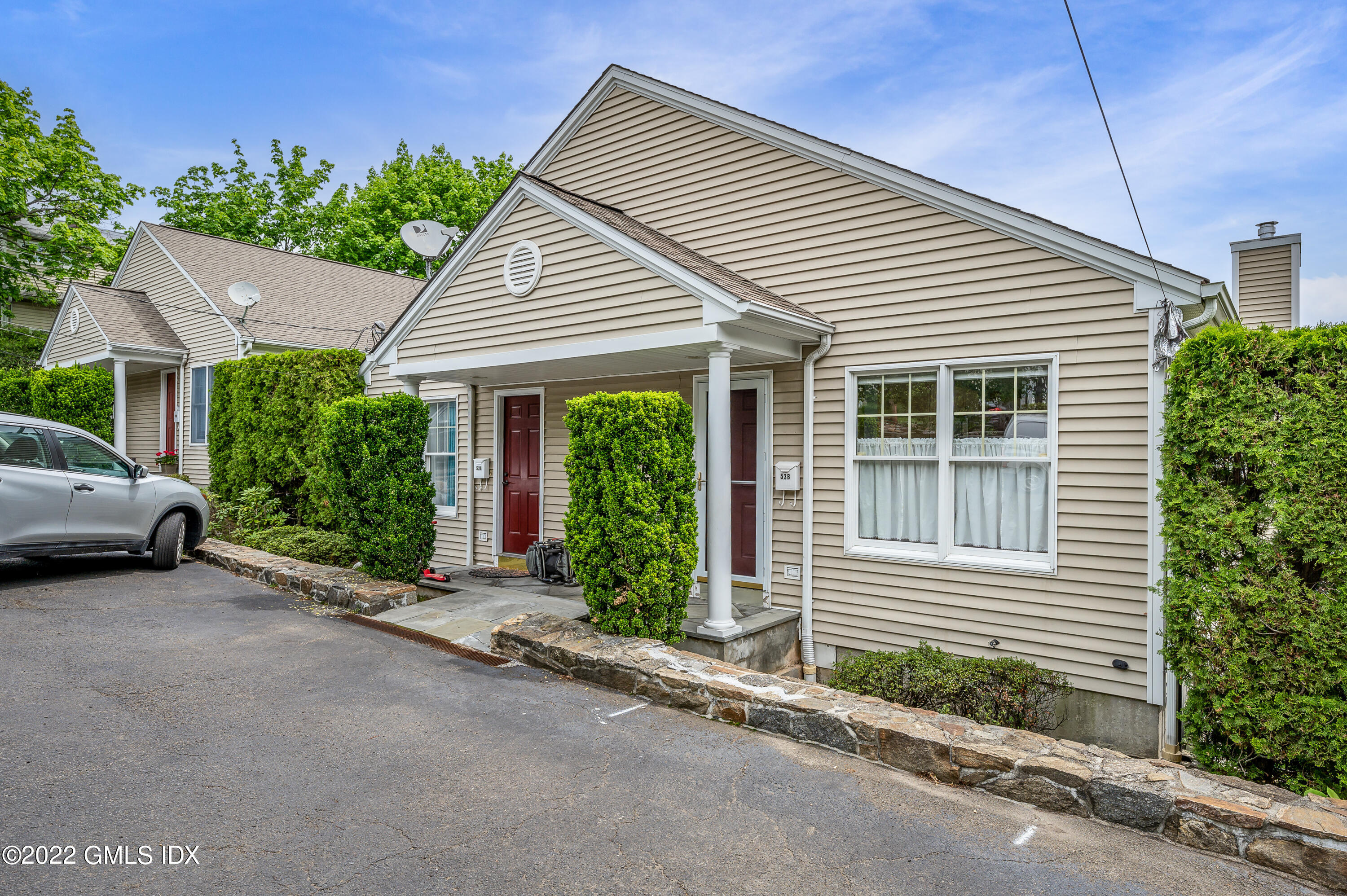 53 Rodwell Avenue, Unit B Greenwich, CT 06830 - Photo 2 of 33 a view of a house with a garden