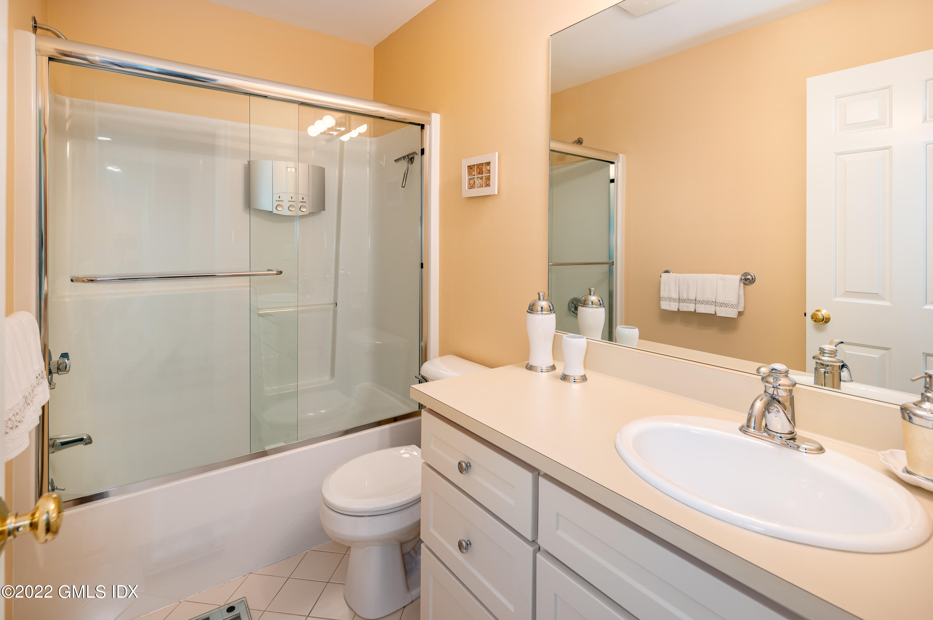 53 Rodwell Avenue, Unit B Greenwich, CT 06830 - Photo 23 of 33 a bathroom with a sink a toilet and shower
