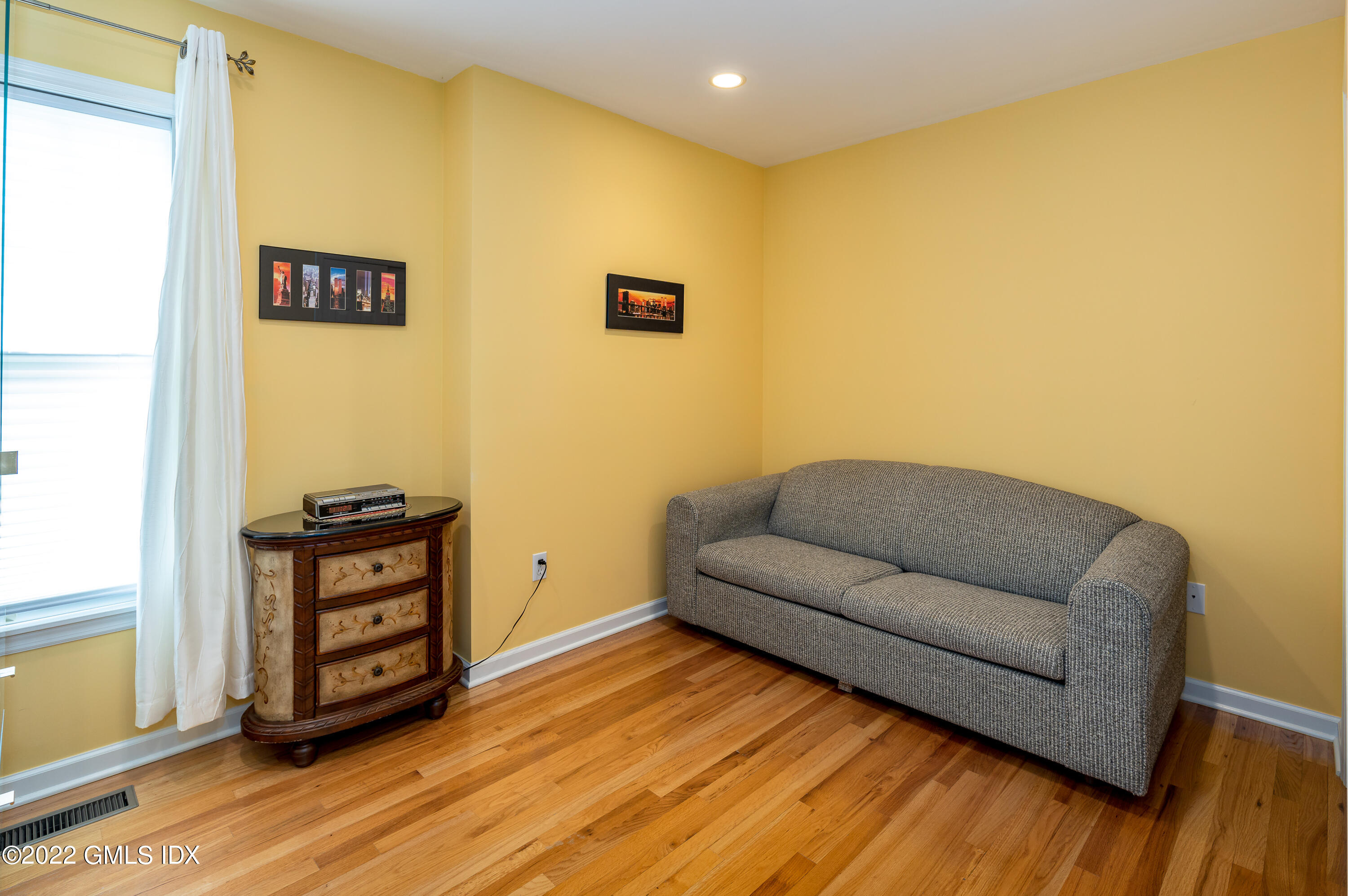53 Rodwell Avenue, Unit B Greenwich, CT 06830 - Photo 24 of 33 a living room with couch and wooden floor