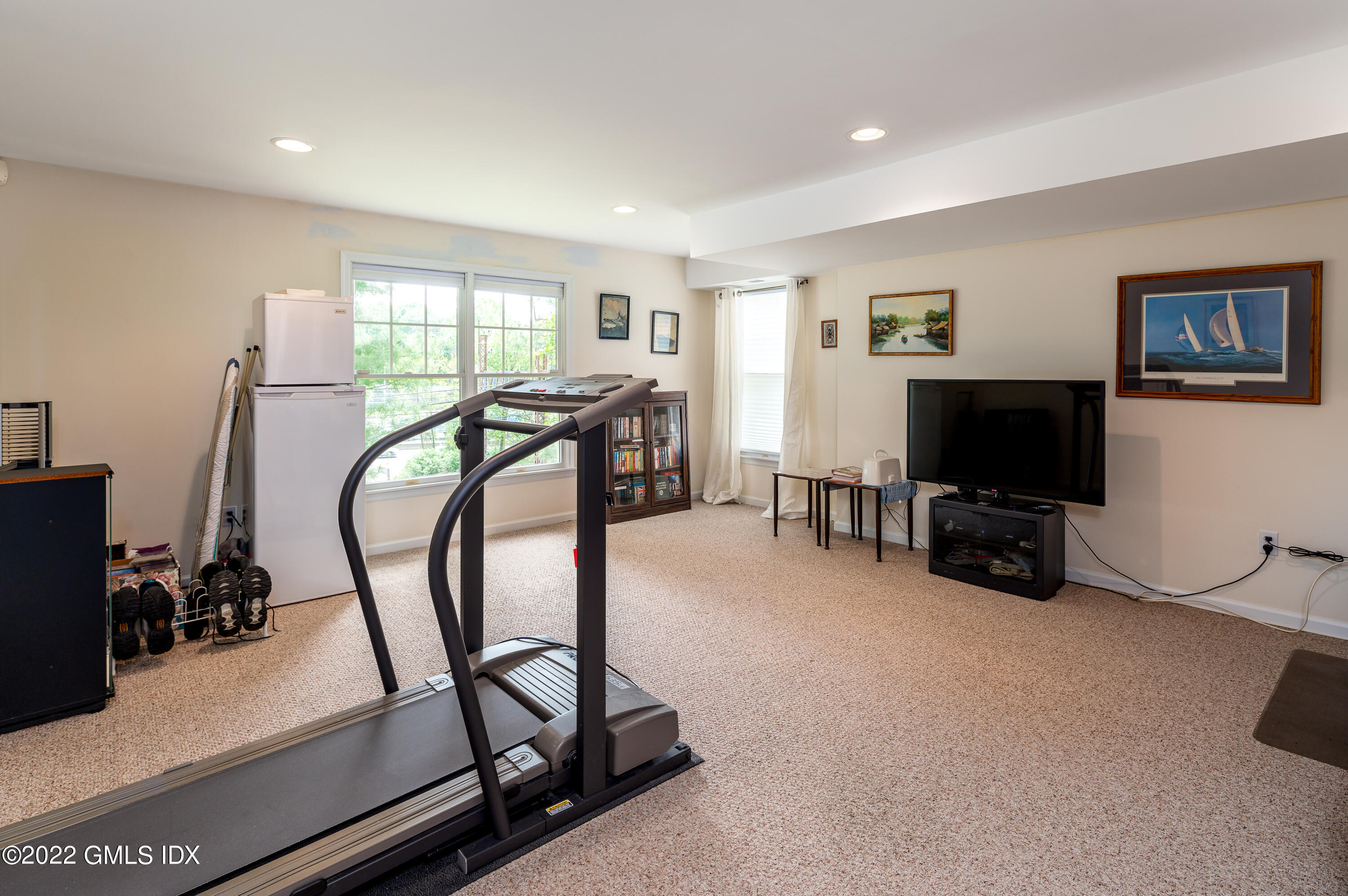 53 Rodwell Avenue, Unit B Greenwich, CT 06830 - Photo 26 of 33 a view of a livingroom with furniture and a flat screen tv
