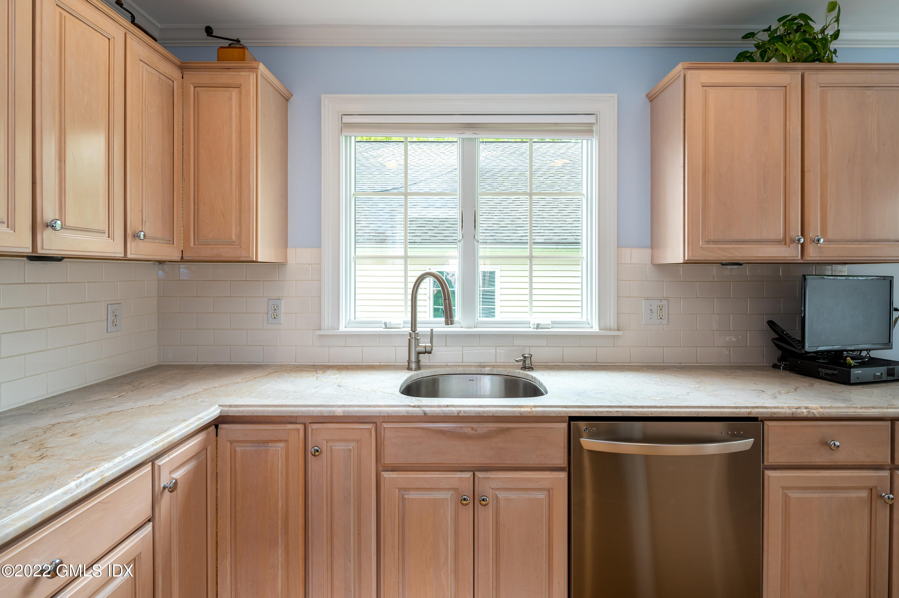 53 Rodwell Avenue, Unit B Greenwich, CT 06830 - Photo 6 of 33 a kitchen with sink cabinets and window