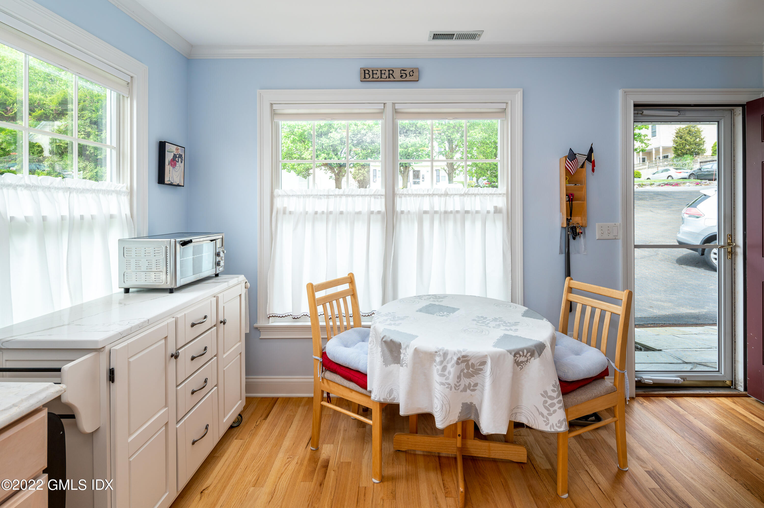 53 Rodwell Avenue, Unit B Greenwich, CT 06830 - Photo 8 of 33 a view of a dining room with furniture and wooden floor