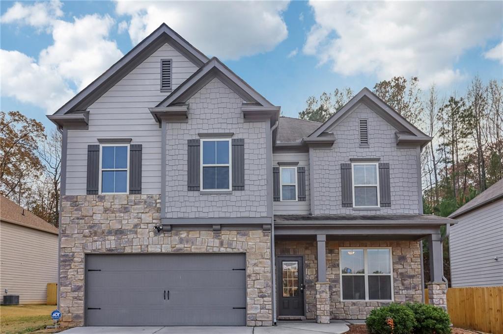a front view of a house with a garage