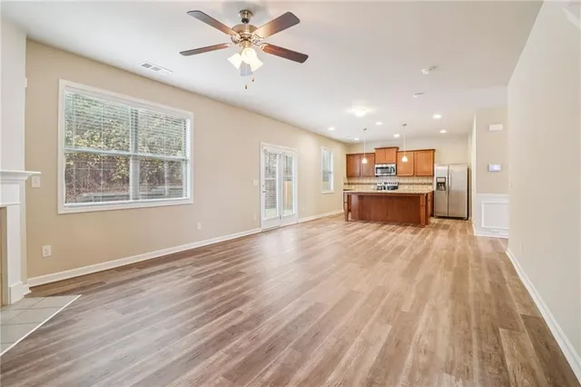 a view of kitchen with sink and wooden floor