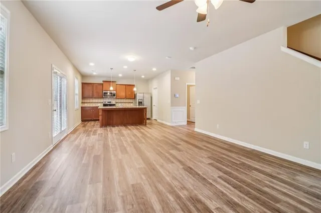 a view of a kitchen with a sink and a refrigerator