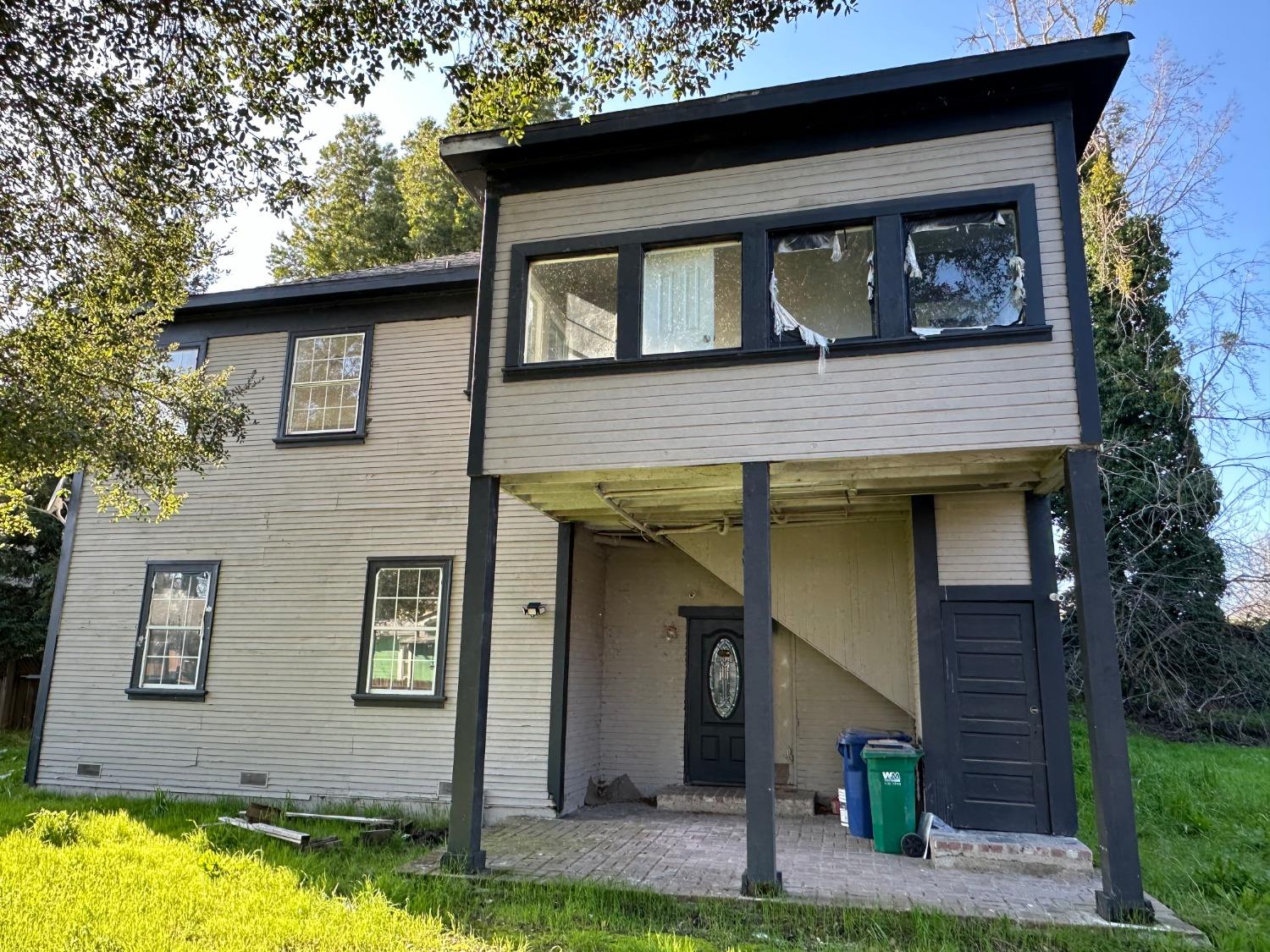 14055 River Road Walnut Grove, CA 95690 - Photo 3 of 55 a front view of a house with a yard