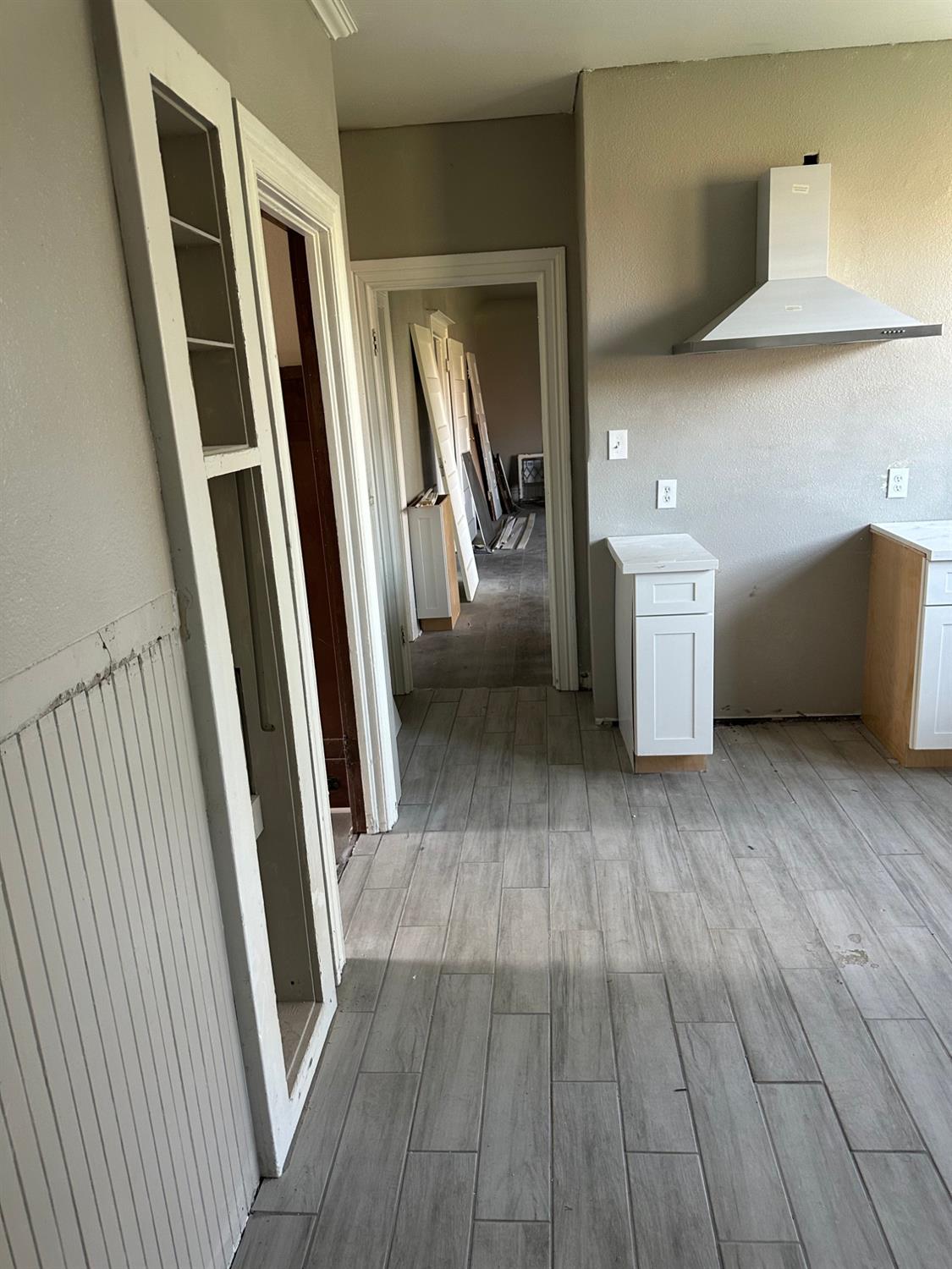 14055 River Road Walnut Grove, CA 95690 - Photo 35 of 55 a view of a hallway with wooden floor