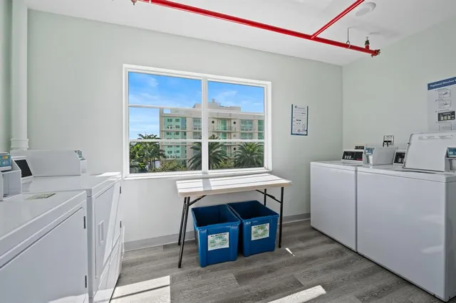a room with a washing machine and sink