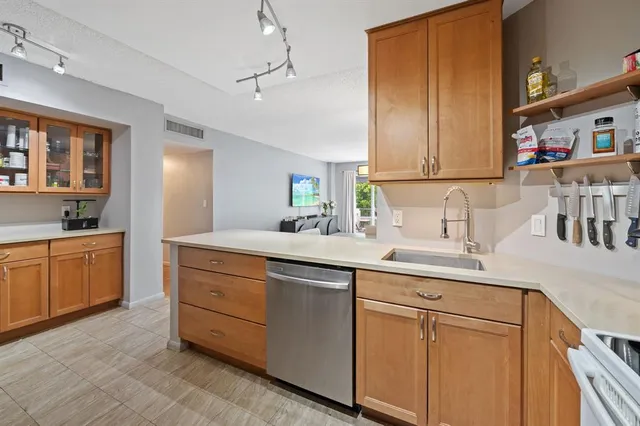 a kitchen with sink cabinets and window