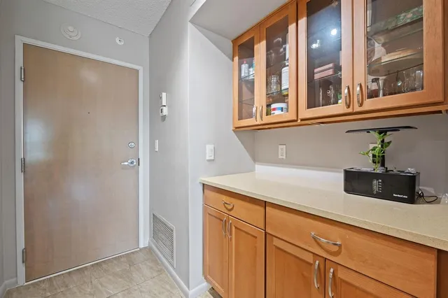 a kitchen with a sink and cabinets