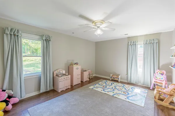 a view of a livingroom with an empty space and a window