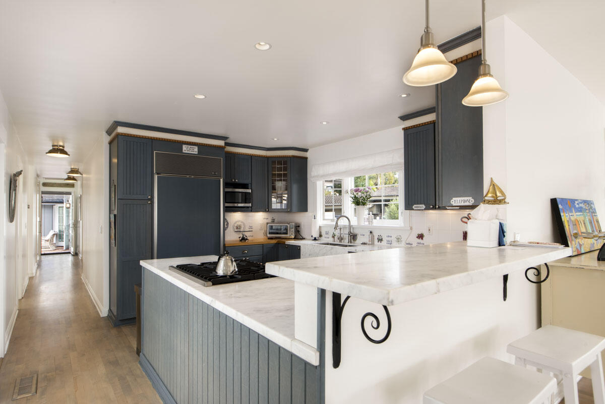 1112 Hill Road Montecito, CA 93108 - Photo 12 of 33 a kitchen with kitchen island a counter top space a sink and appliances