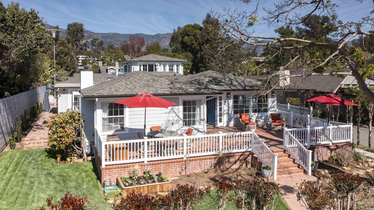 1112 Hill Road Montecito, CA 93108 - Photo 3 of 33 a view of a patio with a table and chairs under an umbrella