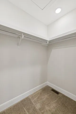 a bathroom with a sink toilet vanity and tub