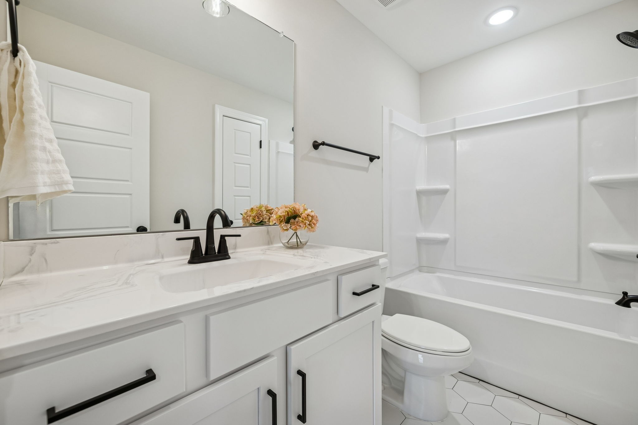 1015 Landing Lane Adams, TN 37010 - Photo 16 of 27 a bathroom with a sink toilet vanity and tub