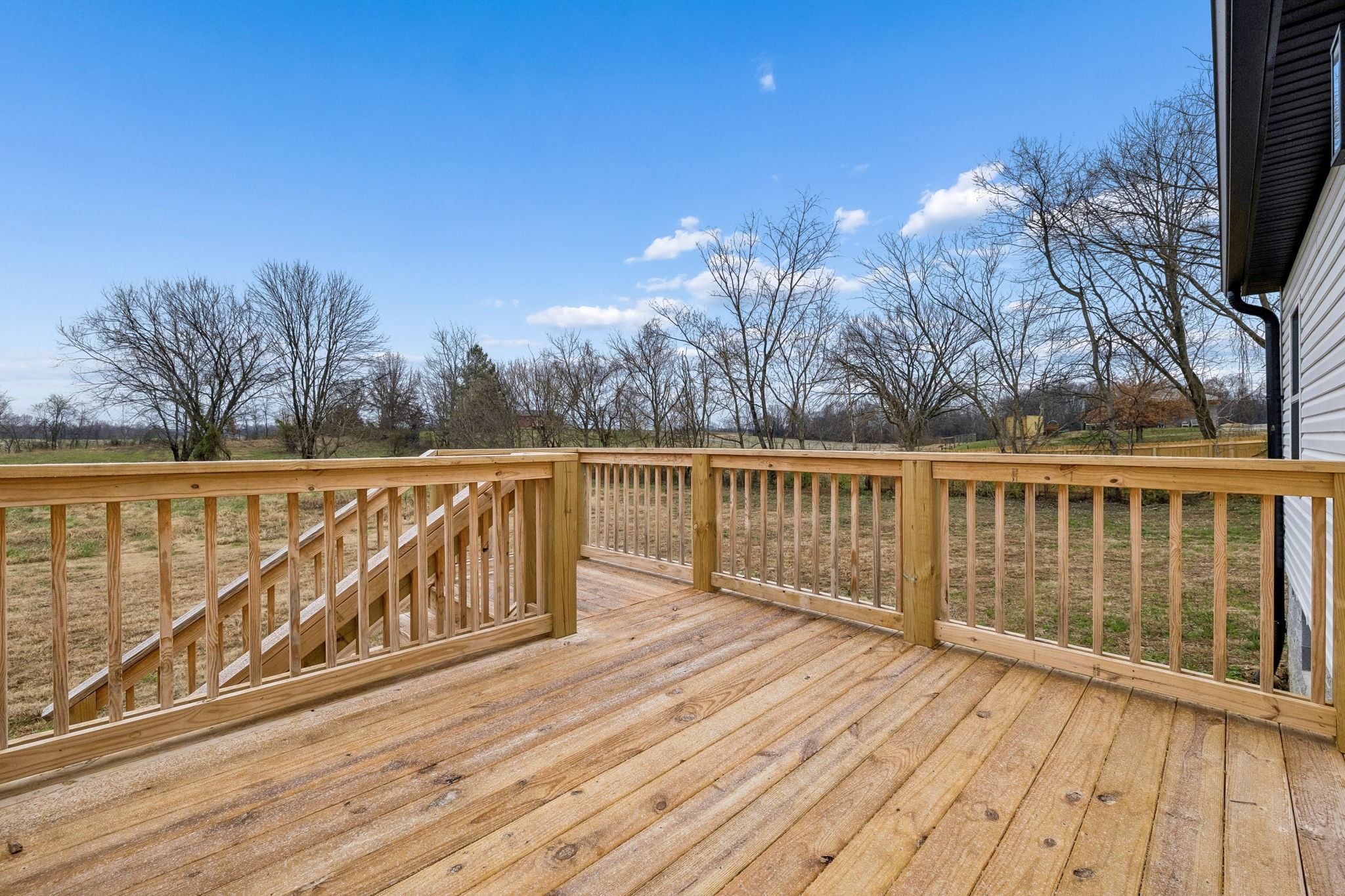 1015 Landing Lane Adams, TN 37010 - Photo 23 of 27 a view of wooden balcony with trees
