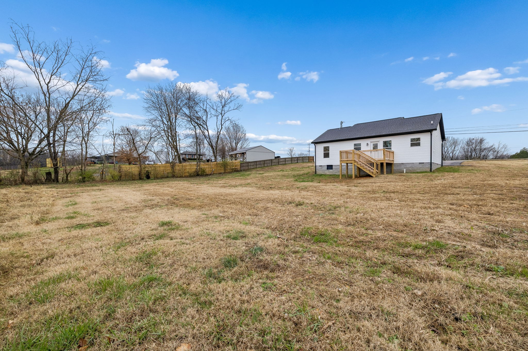 1015 Landing Lane Adams, TN 37010 - Photo 26 of 27 a view of a yard with a house
