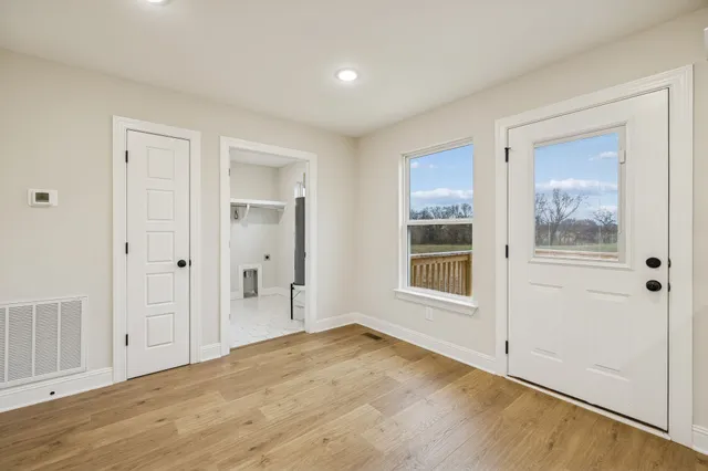 a view of kitchen with sink microwave and stove