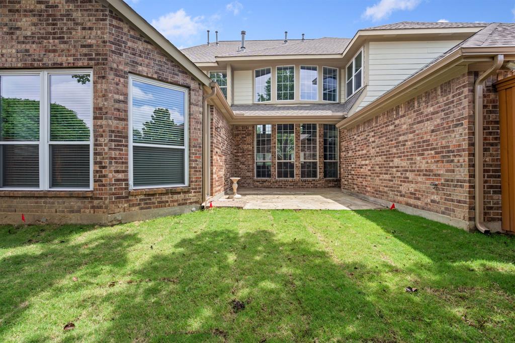 2012 Burnside Drive Allen, TX 75013 - Photo 38 of 40 a view of a brick house with a large windows