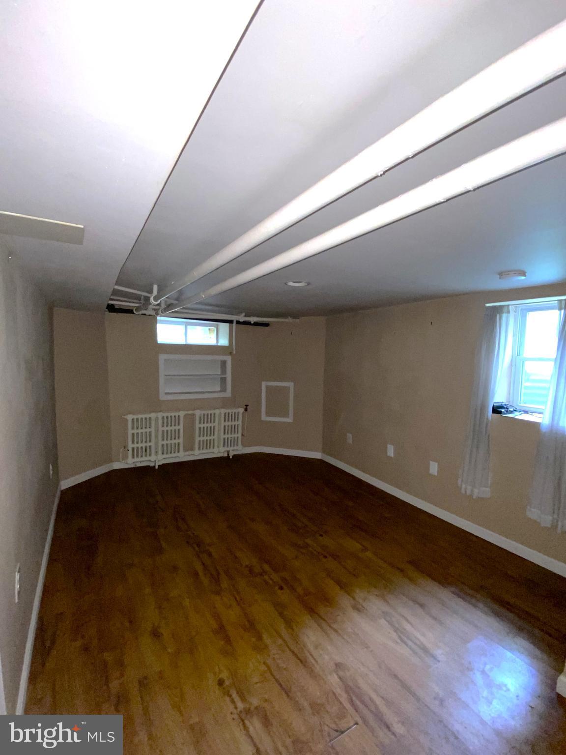 435 Nutt Road, Unit 3 Phoenixville, PA 19460 - Photo 2 of 5 a view of an empty room and wooden floor