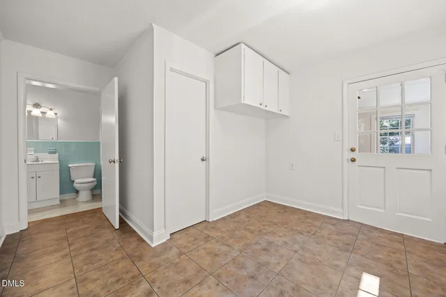 a view of a bathroom with sink and mirror