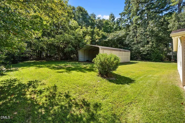 a view of a pool with a yard