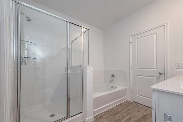 a bathroom with a bathtub and a shower