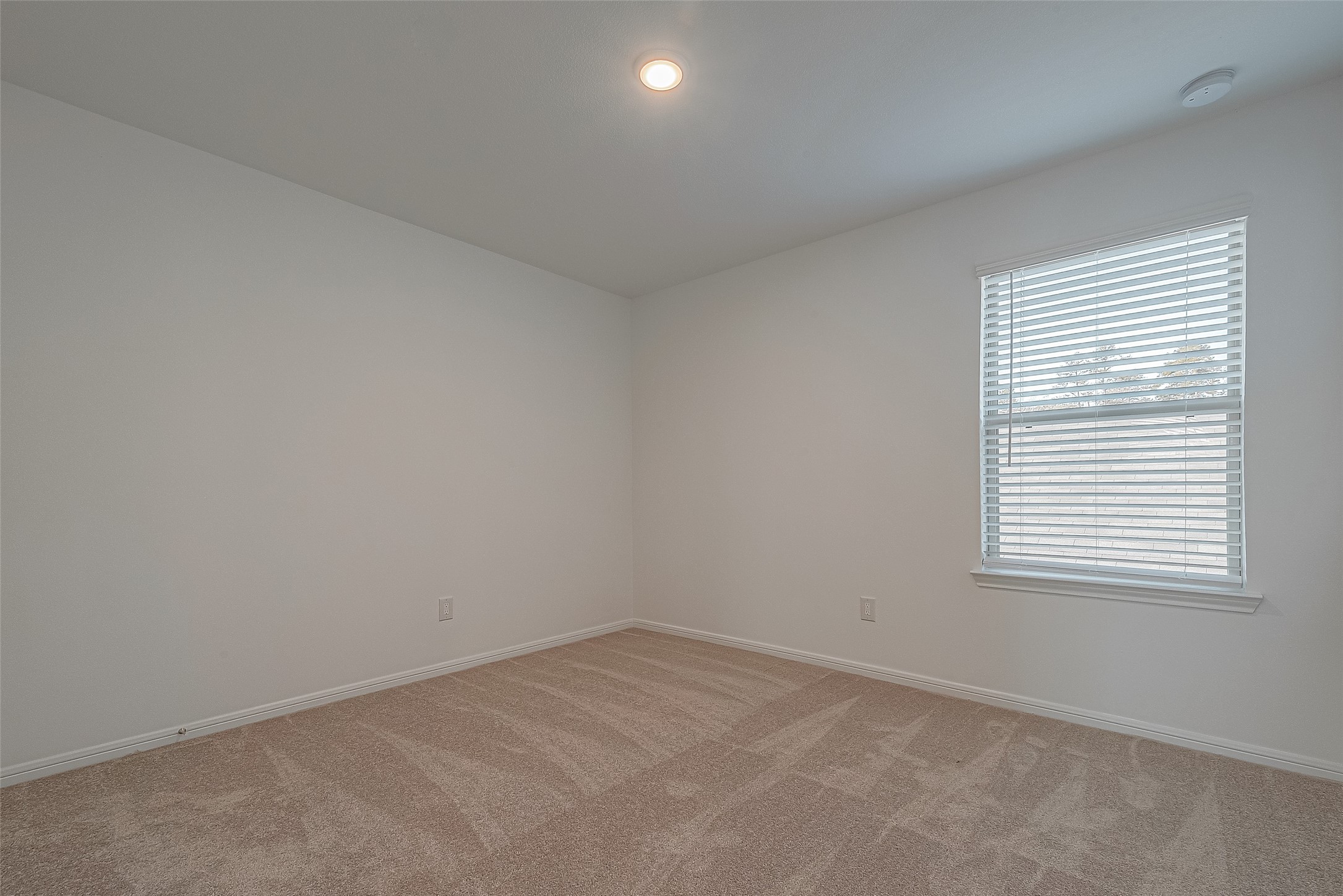 325 Maple Bark Trail Willis, TX 77378 - Photo 18 of 22 an empty room with a window