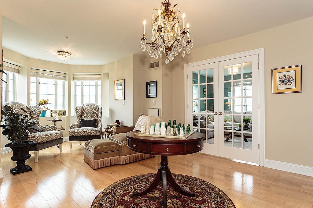 20 Chapel Street, Unit C1001 Brookline, MA 02446 - Photo 3 of 28 a living room with furniture and a large window