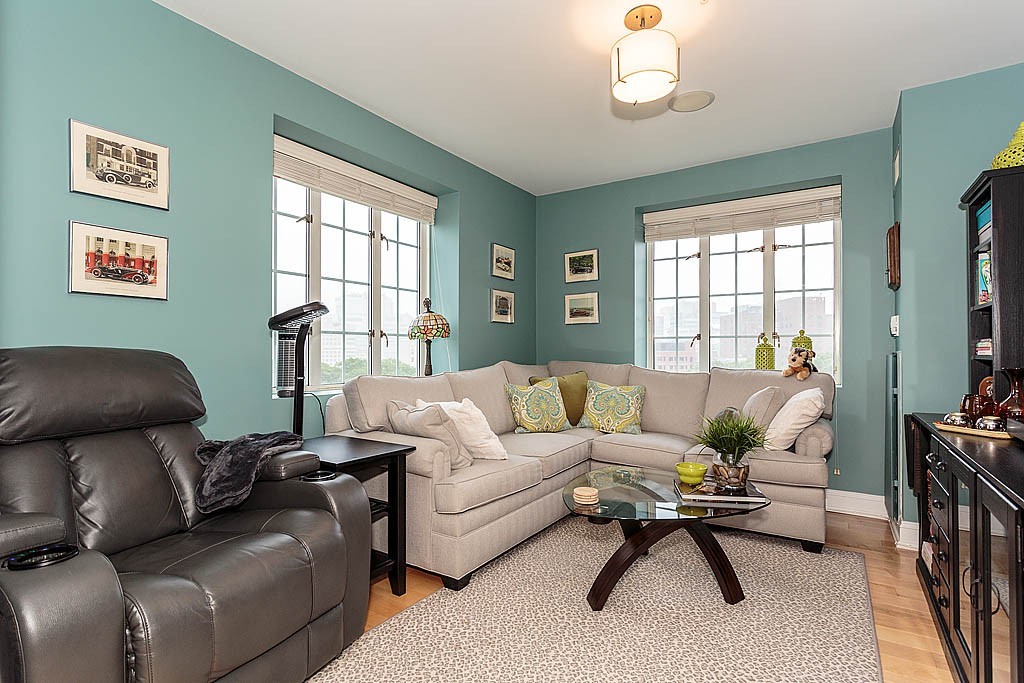 20 Chapel Street, Unit C1001 Brookline, MA 02446 - Photo 5 of 28 a living room with furniture and a window