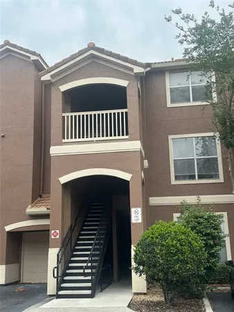 a view of a house with more windows and a balcony
