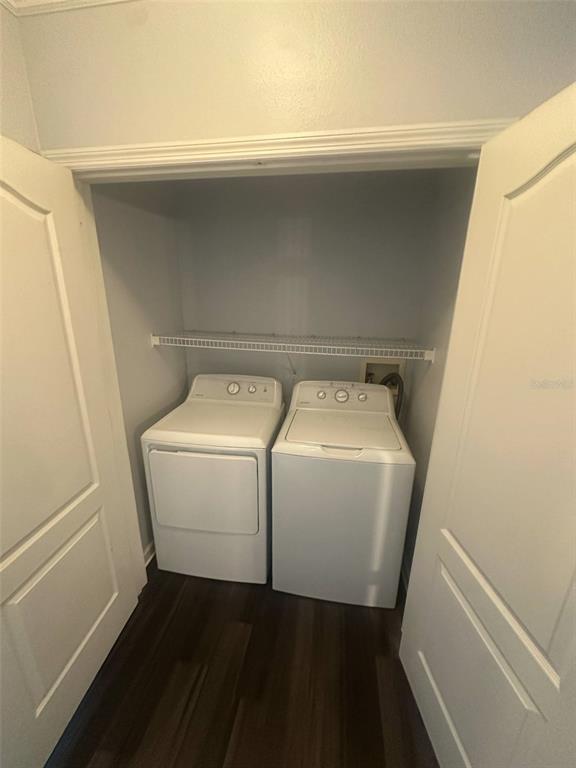 19935 Villa Isle Drive Orlando, FL 32821 - Photo 13 of 17 a utility room with dryer and washer