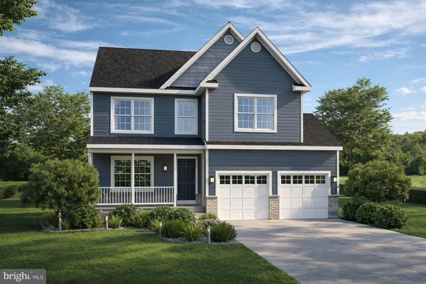 a view of a house with yard and plants