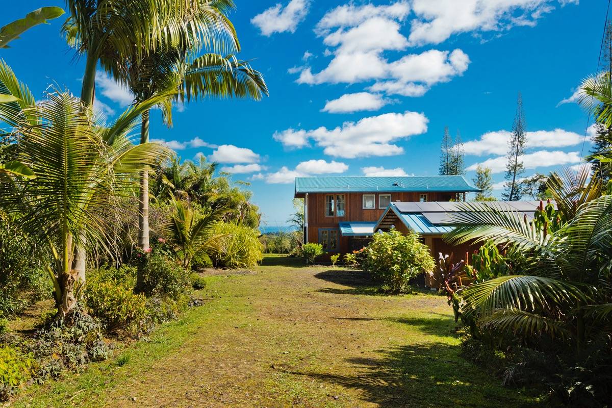 18-3952 Canney Road Mountain View, HI 96771 - Photo 1 of 30 a view of a house with a yard