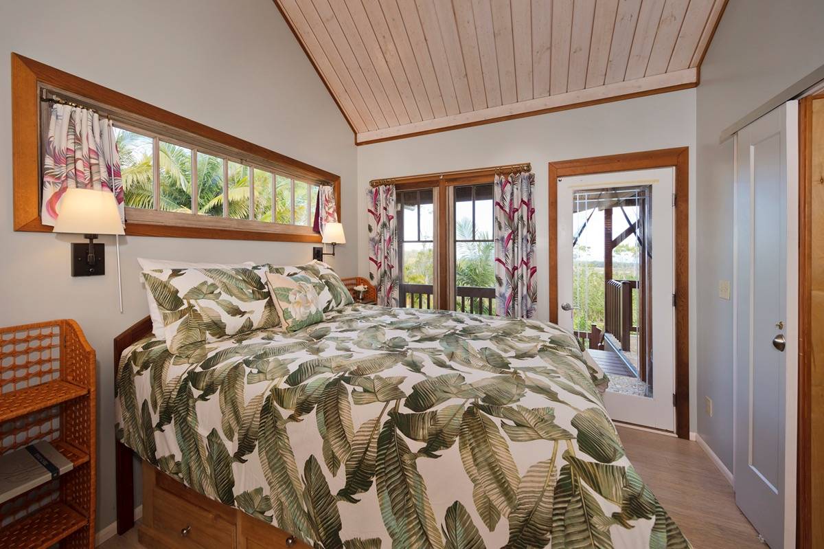 18-3952 Canney Road Mountain View, HI 96771 - Photo 18 of 30 a bed sitting in a bedroom next to a window