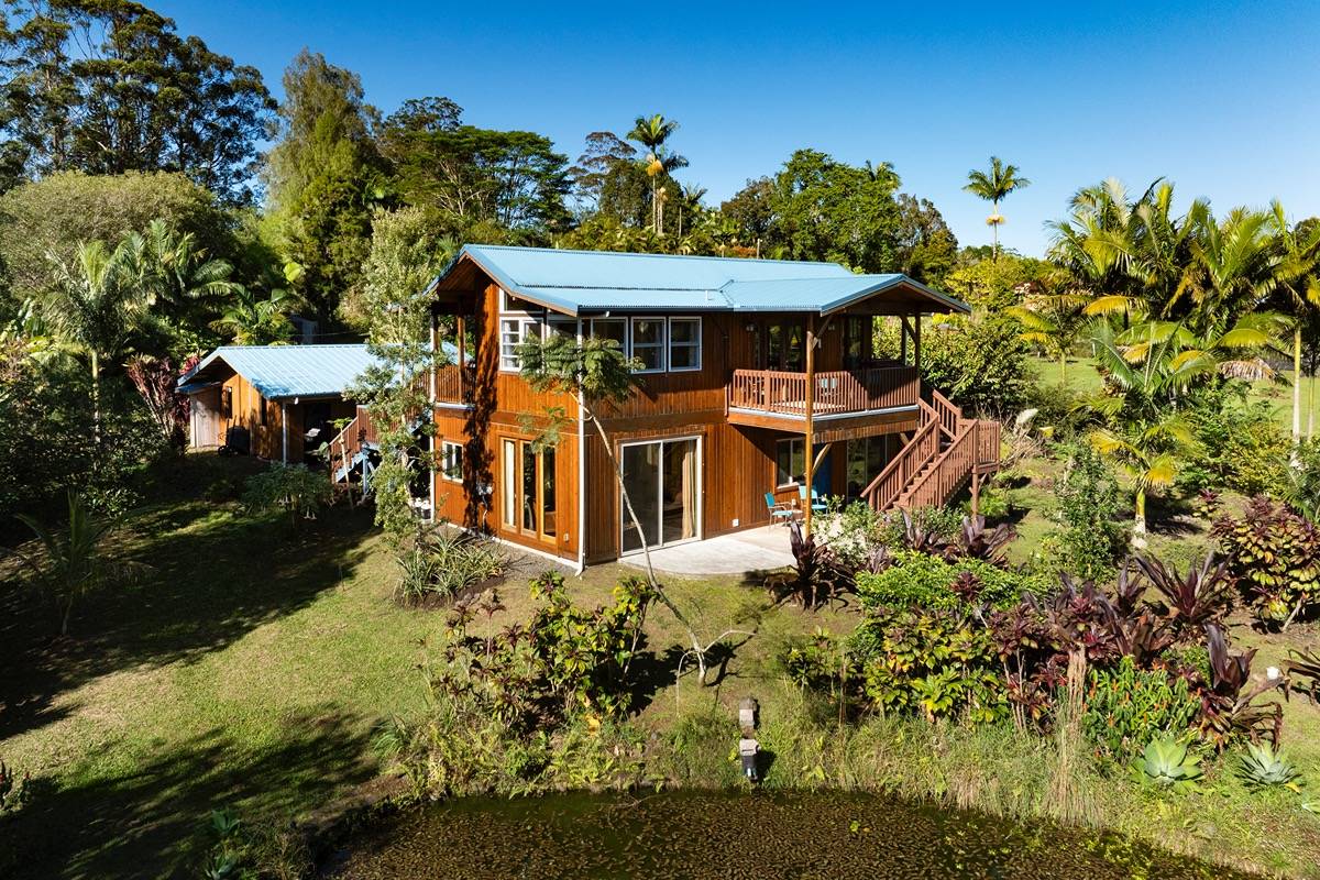 18-3952 Canney Road Mountain View, HI 96771 - Photo 6 of 30 an aerial view of a house with a yard