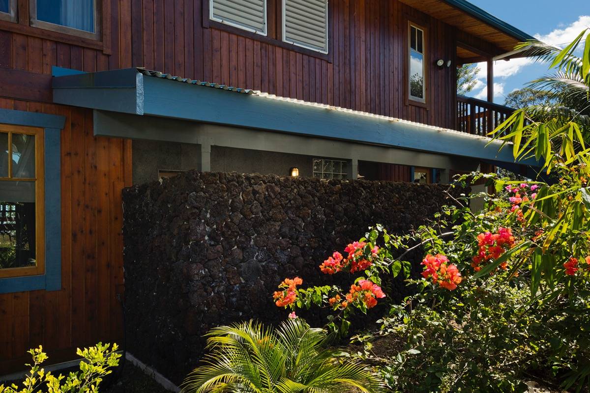 18-3952 Canney Road Mountain View, HI 96771 - Photo 8 of 30 a bunch of flowers in front of house