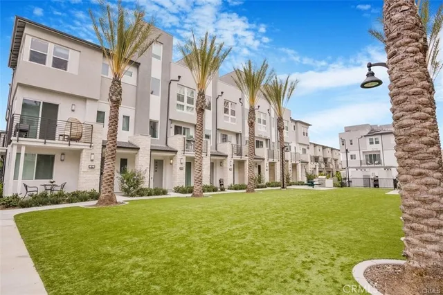 a view of a building with a yard