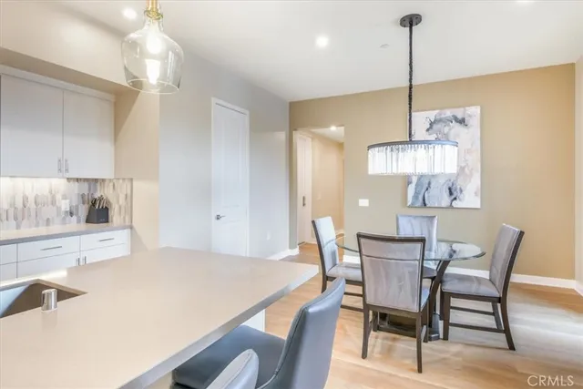 a dining room with a table and chairs