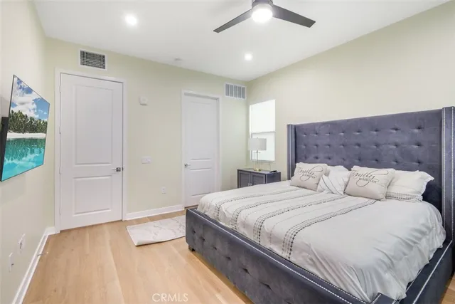 a bathroom with a double vanity sink toilet and mirror