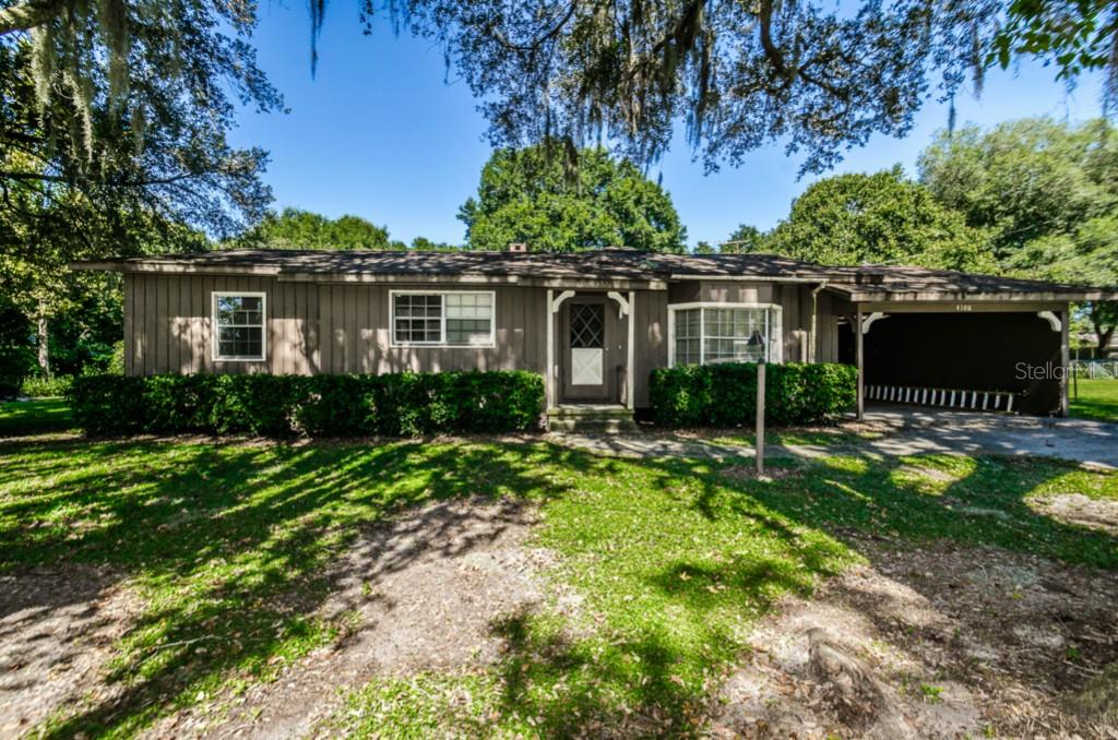 4108 Peacock Road Plant City, FL 33565 - Photo 1 of 1 a front view of house with yard and green space