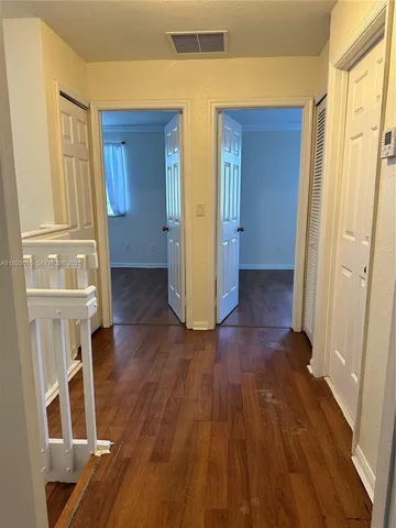 a view of entryway with wooden floor