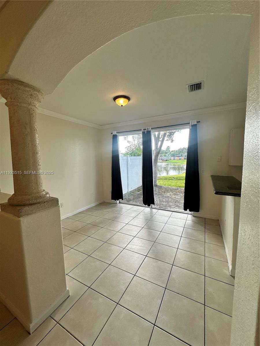 2704 Southeast 15th Place, Unit 152 Homestead, FL 33035 - Photo 2 of 35 a view of an empty room with a window