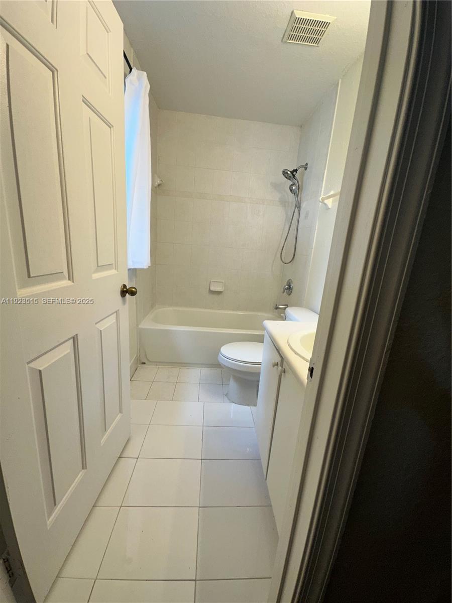 2704 Southeast 15th Place, Unit 152 Homestead, FL 33035 - Photo 25 of 35 a bathroom with a sink a toilet and a shower