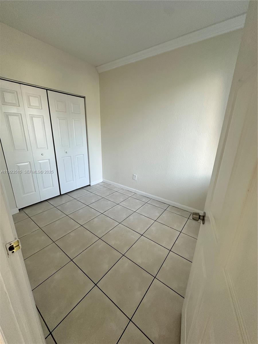 2704 Southeast 15th Place, Unit 152 Homestead, FL 33035 - Photo 29 of 35 a view of a garage